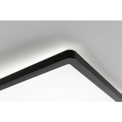 Corner view of a modern LED ceiling light with a black frame, radiating soft light.