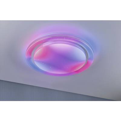 A ceiling-mounted, round light emits soft pink and blue light, creating a soothing atmosphere.