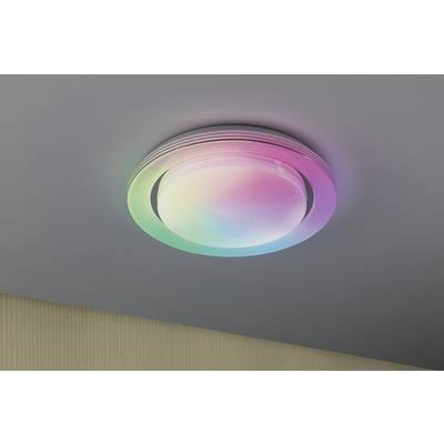 A round ceiling light displays a rainbow colour play.