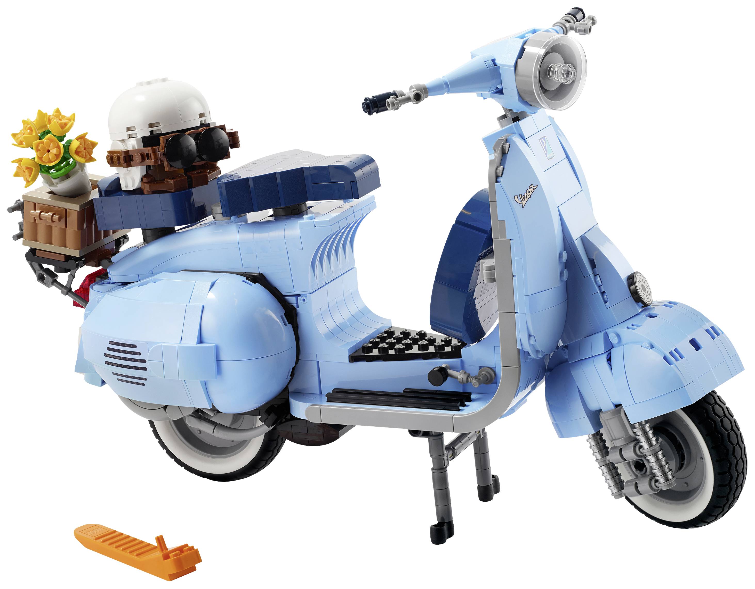 A light blue toy scooter with a flower basket and helmet on the seat. It rests on a stand and has an orange tool spotlight.