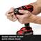 A hand is holding a cordless drill fitted with a double-sleeved quick-release chuck, wide view.