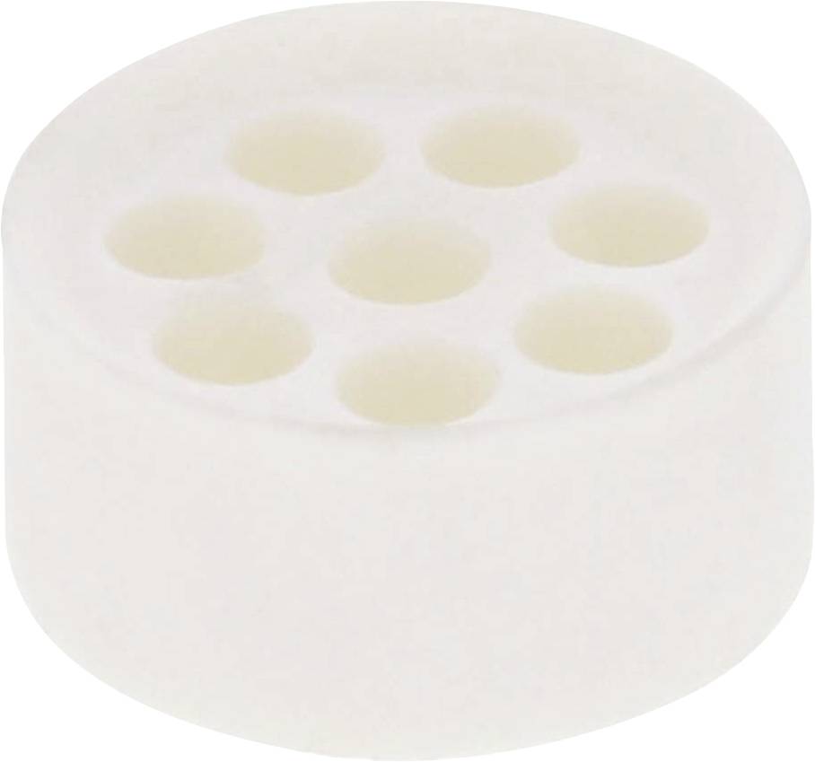 A white, cylindrical object with seven indentations on its top surface.