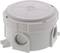 Round, grey plastic junction box with multiple cable entries, suitable for electrical installations.