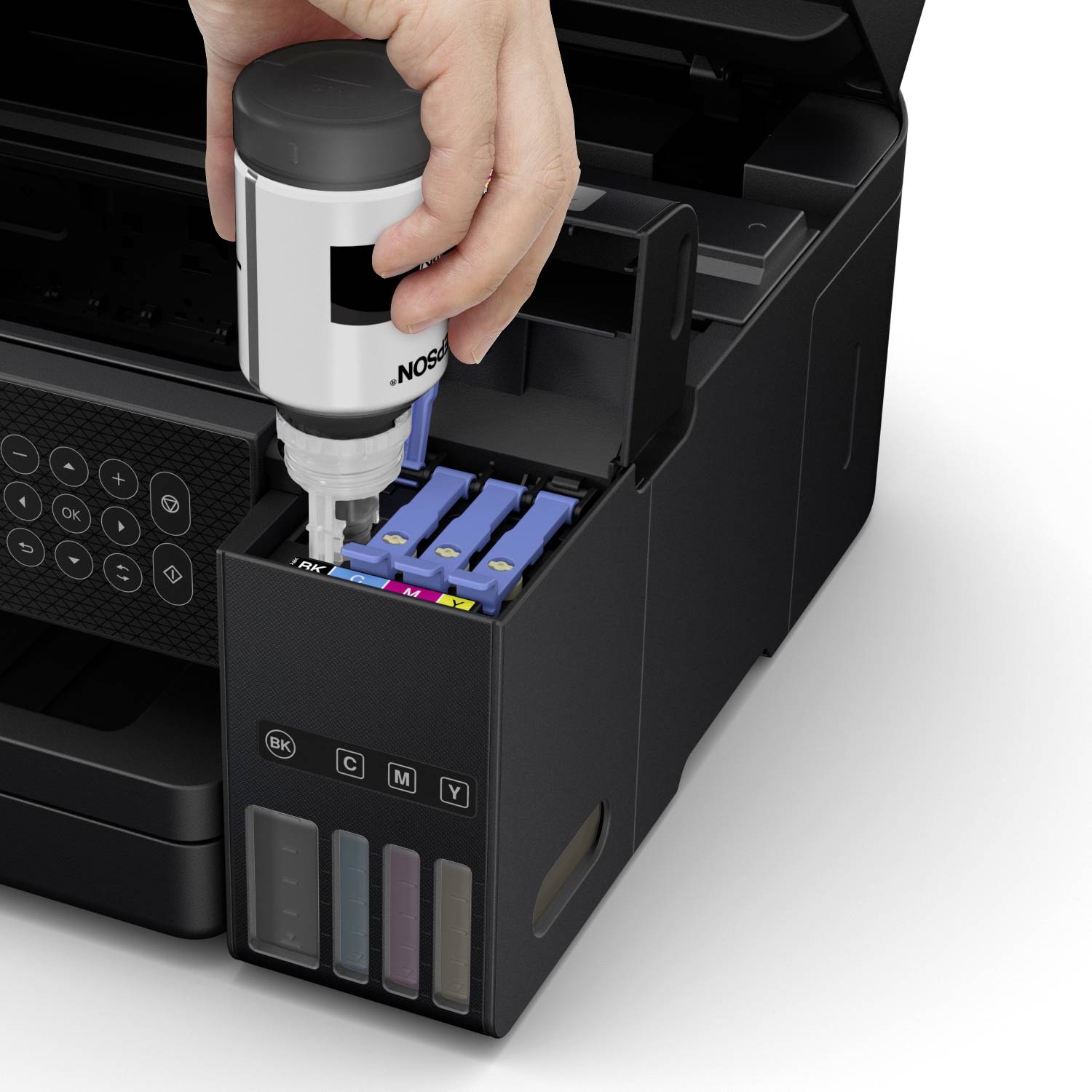A hand fills a printer cartridge with black ink. The container shows three other colours that are still full. Focus on the filling process.