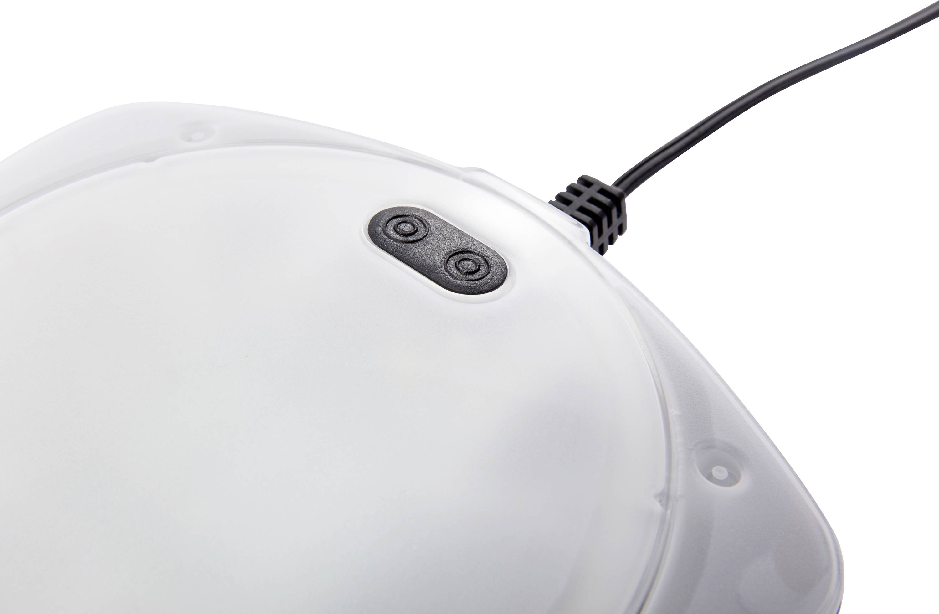 A round, white device with an attached cable, featuring two black buttons on its top surface, can be seen.