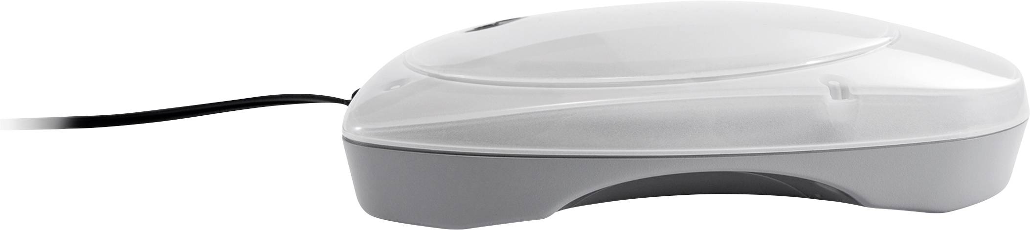 A white computer mouse with a cable, photographed from the side, on a grey surface.