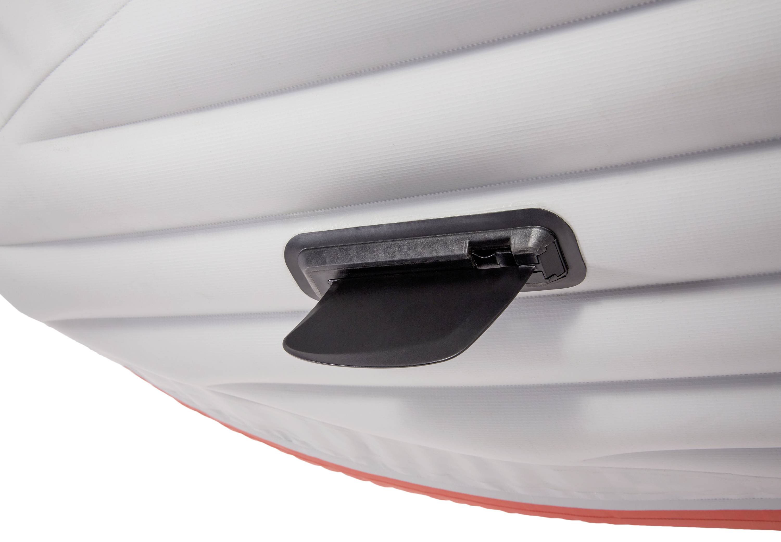 A black plastic fin on the underside of a white boat, presumably for stabilisation in water.