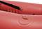 Red inflatable dinghy detail with metal loops and black straps.