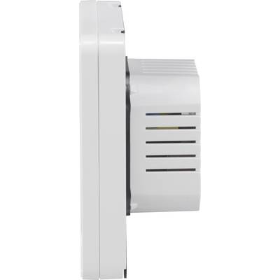 Side view of a white smoke detector, mounted on a wall. The housing has slots for sensors and ventilation.