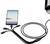 A smartphone is connected to a laptop via a cable with multiple ports. The phone's screen displays a sunset.