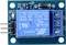 'Relay module with blue switching component, three screw terminals and two metal pins on green PCB. Labelled with SRD-05VDC-SL-C.'