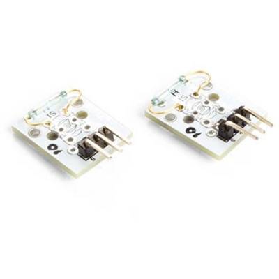 Two small electronic circuit boards with copper wire arches and pins lying side by side.