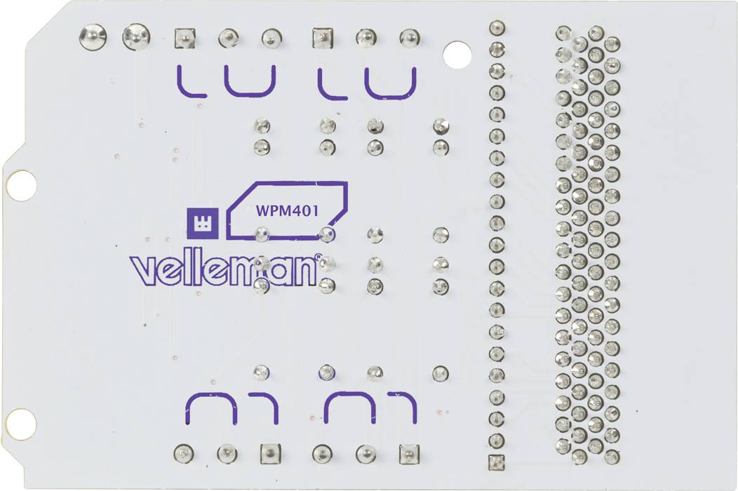 Back of an electronic circuit board with the inscription 'velleman®' and 'WPM401'. Utilising soldering points and plug contact points.