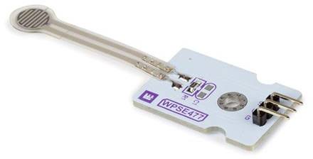 Electronic pressure sensor with three pin connections on a white circuit board. Model number 'WPSE477' printed on the surface.