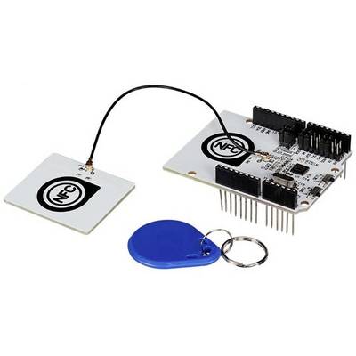 White NFC circuit board with connected antenna and blue RFID chip on a keyring. Suitable for contactless communication.