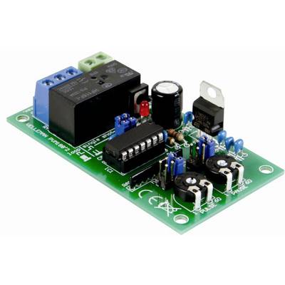 A green electronic circuit board with blue terminal blocks, a black relay, a microchip, and several capacitors and resistors.