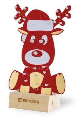 A red reindeer with glowing LEDs for its nose and eyes sits on a wooden base with the inscription 'Whadda'.