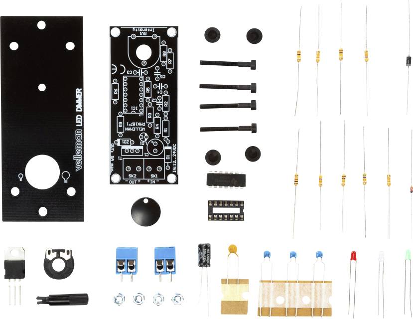 Electronic DIY kit with printed circuit board, resistors, LEDs, capacitors and various components for assembling an LED dimmer.