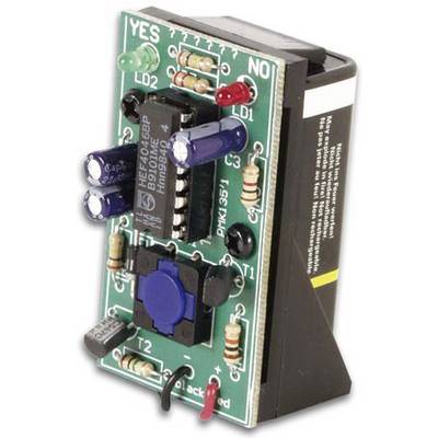 Electronic circuit on a circuit board with resistors, capacitors, and IC chip, mounted in a black plastic housing.