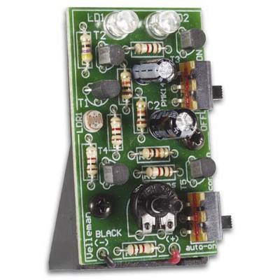 'Electronic switching module with multiple resistors, LEDs and transistors on a green circuit board with labels.'