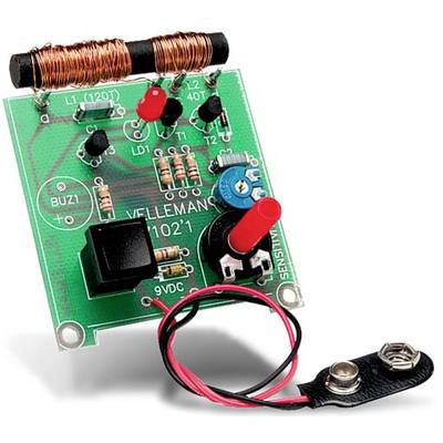 Electronic circuit kit with capacitors, resistors, diodes and battery terminal on green etched PCB.