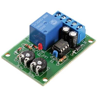 A green printed circuit board with a blue relay module, capacitors, resistors, and a red LED light on it.