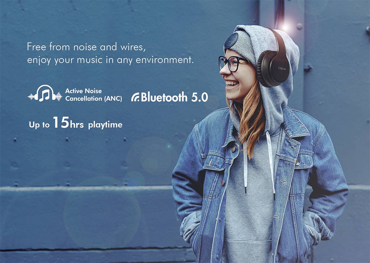 Woman wearing headphones in a denim jacket smiles. Text: 'Active Noise Cancellation (ANC), Bluetooth 5.0, up to 15 hrs playtime'.