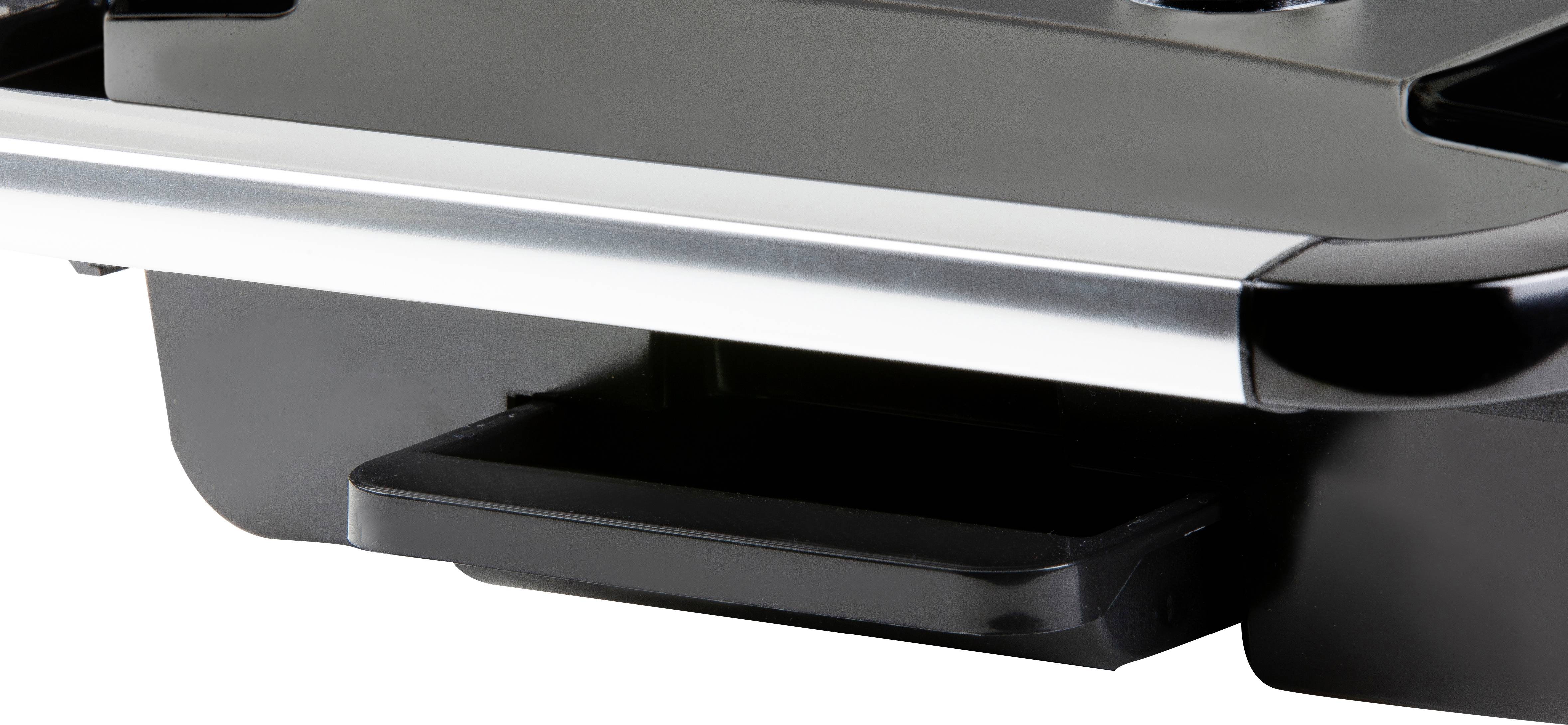 Black device with a silver border and a protruding drawer at the bottom, possibly part of an electronic device or machine.