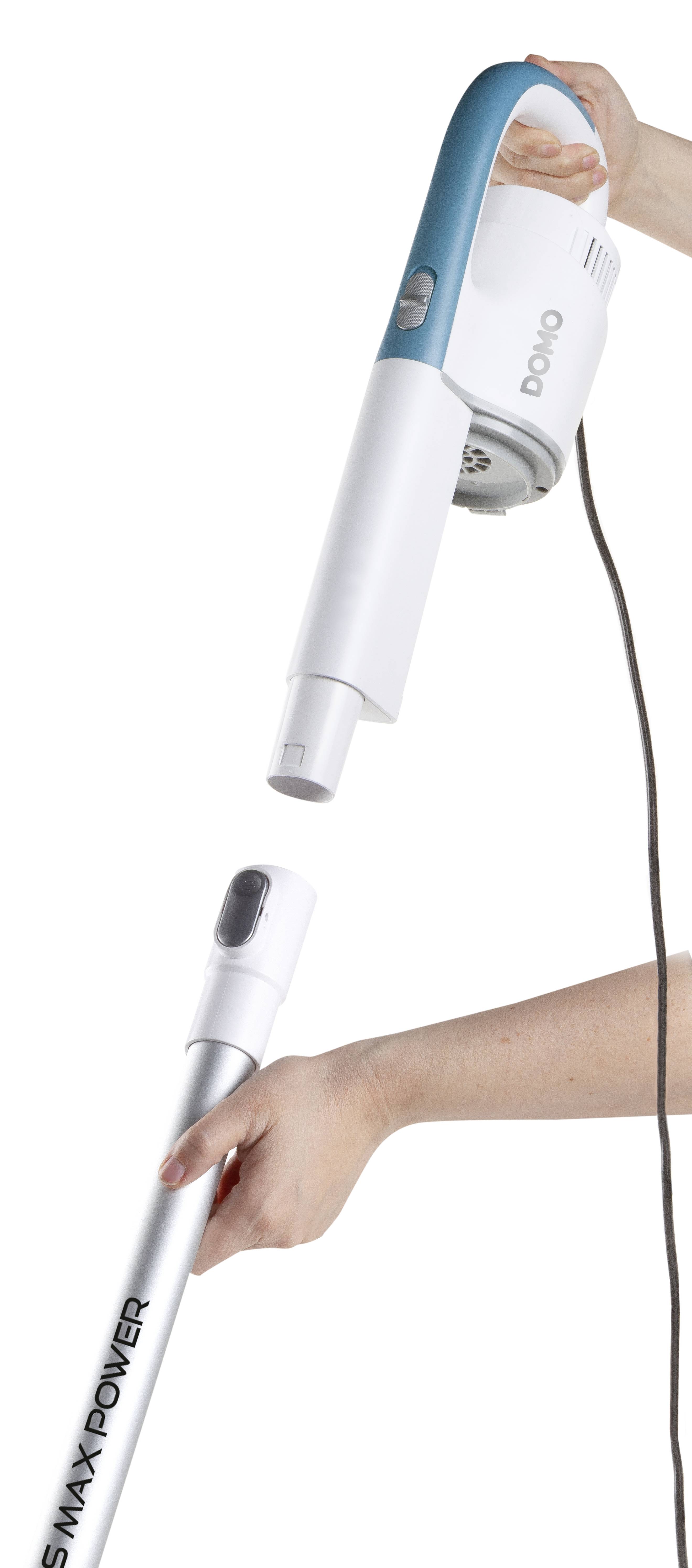 A vacuum cleaner is being assembled by two hands, one holding the main body, the other inserting the suction tube.