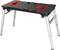 Small, portable folding table with black metal legs and a red and black work surface. Suitable for workshop tasks.