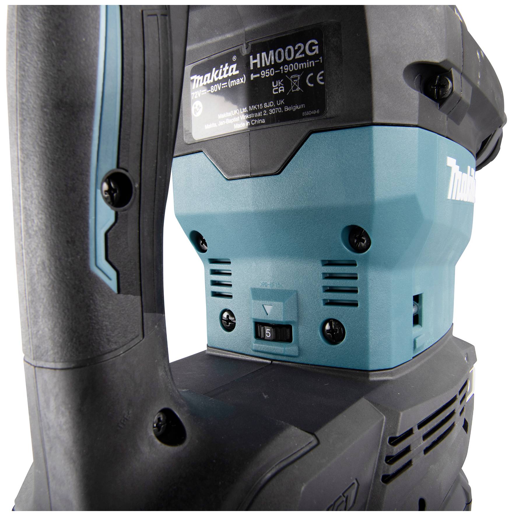 A Makita demolition hammer in close-up. The brand logo, model number, and tool controls are visible.