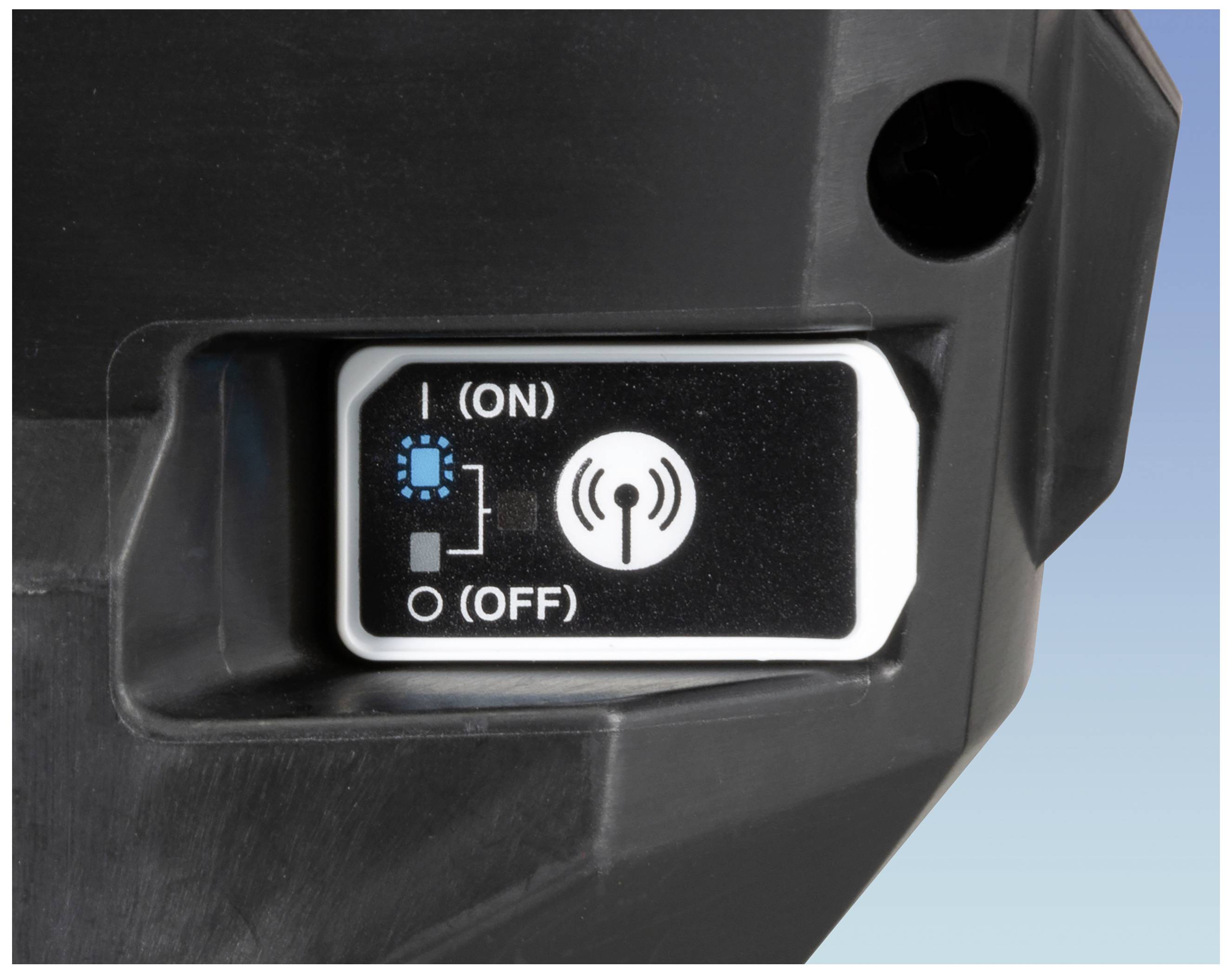 A black switch with 'ON' and 'OFF' settings on a device. A symbol indicates wireless connectivity capability.