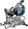 Mitre saw with blue-black casing, folded-out saw table. Suitable for precise cutting of wood and metal.