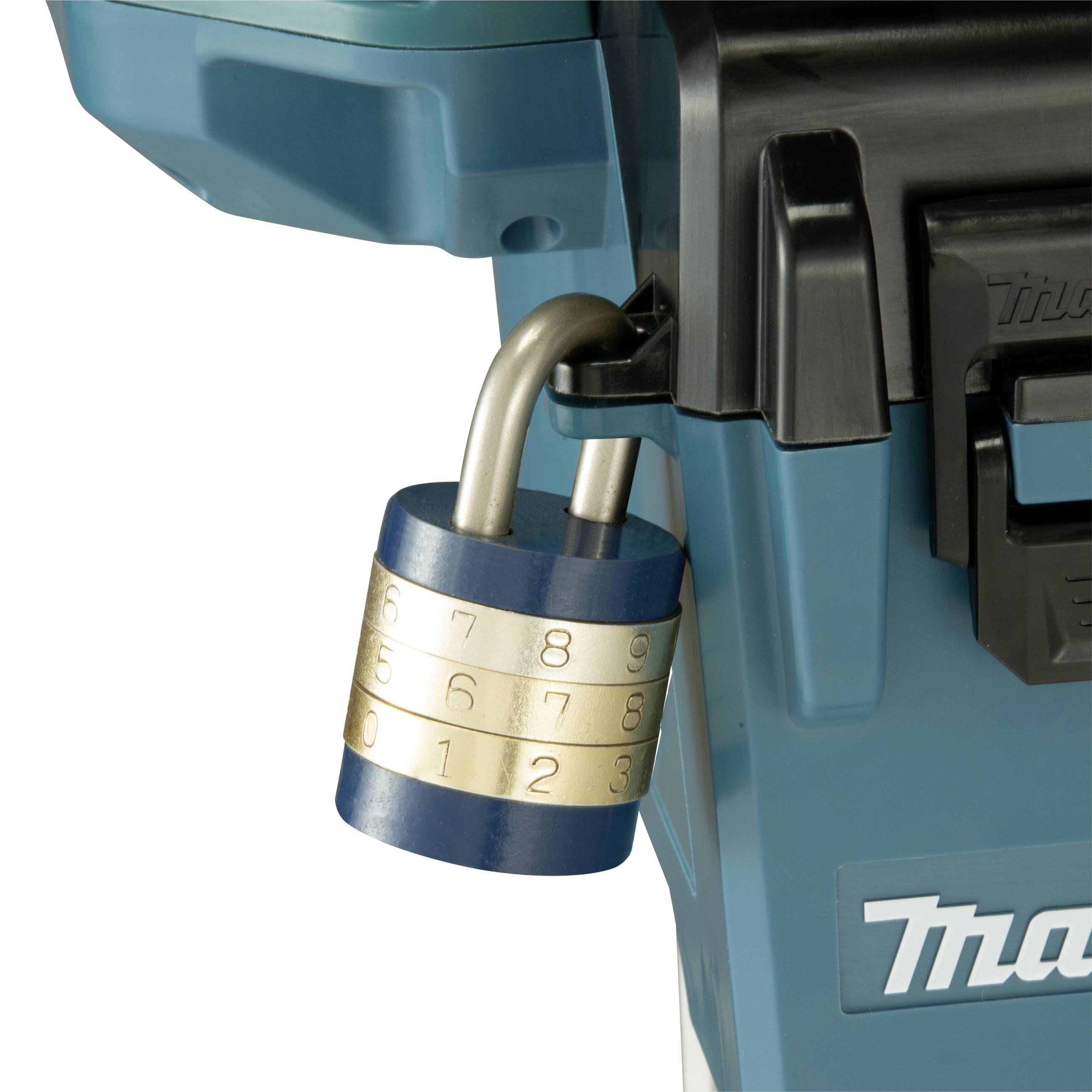 A rotatable combination padlock is hanging on a green toolbox.