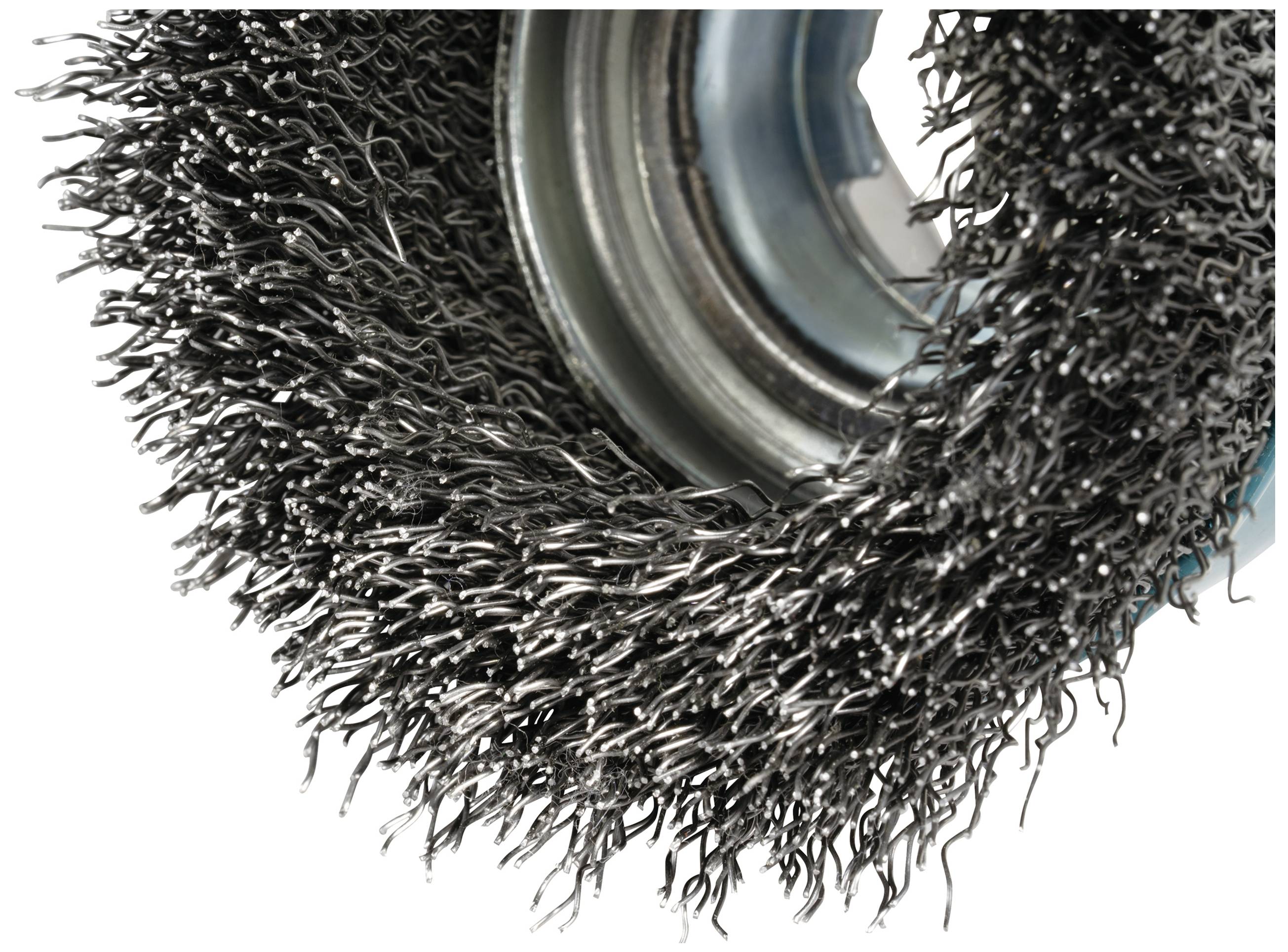 Close-up of a rotating wire brush with dense metal bristles, used for cleaning or removing rust.
