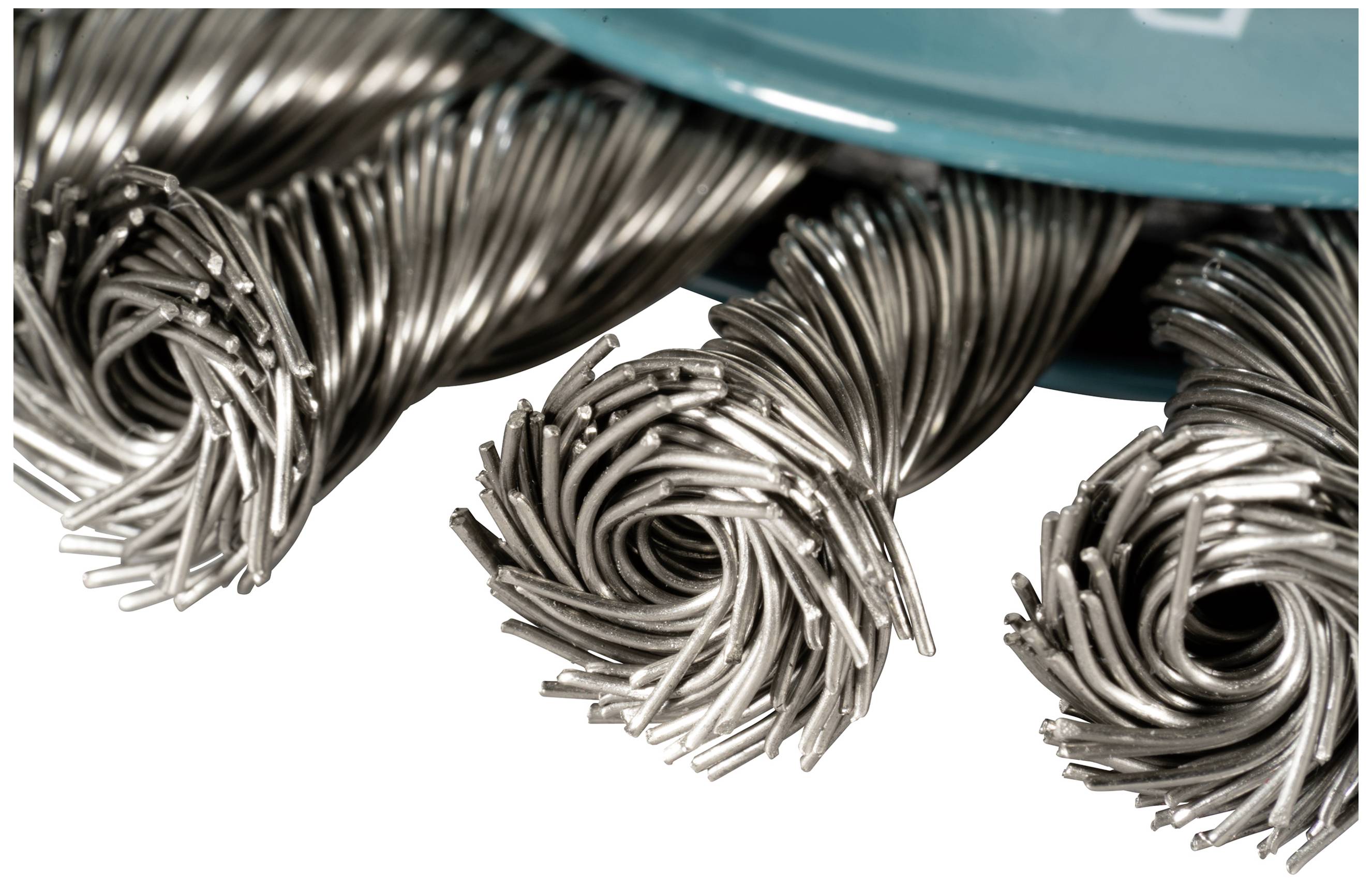 Several twisted metal bristles are arranged in a spiral pattern when viewed from above. They appear robust and industrial.