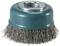 Round wire brush with metal bristles and green plastic housing, suitable for removing rust or paint from metal surfaces.