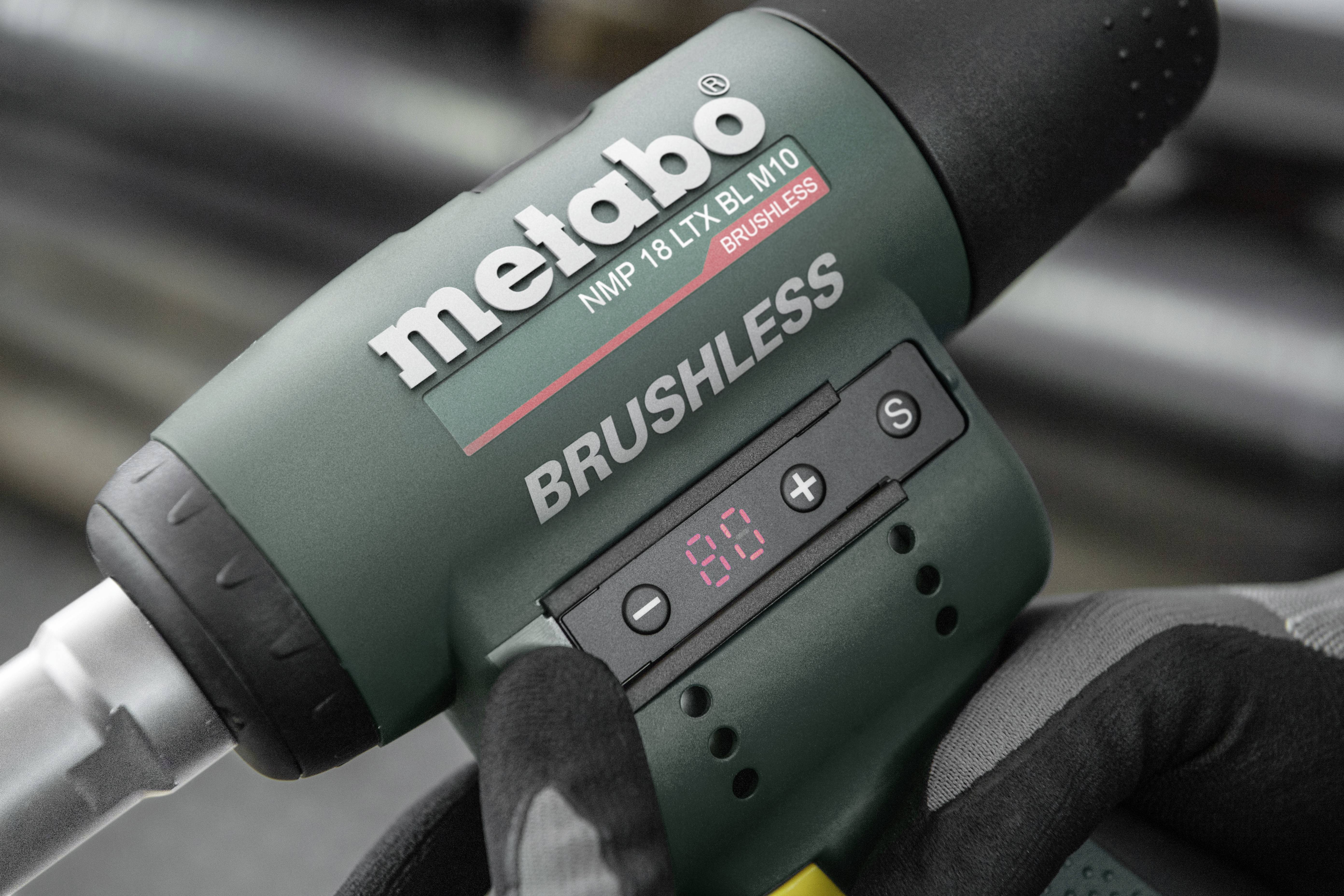 A green Metabo cordless drill focusing on the 'Brushless' label and a digital display showing '80'.