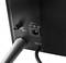 Close-up of an electrical socket with "6V", an on/off switch, and a cable leading to a television.