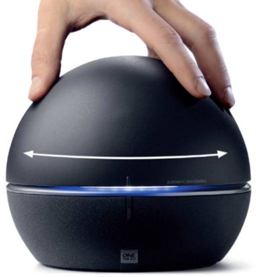A hand is holding a spherical, black device with a blue illuminated display. A double-headed arrow indicates the rotational capability of the upper half.
