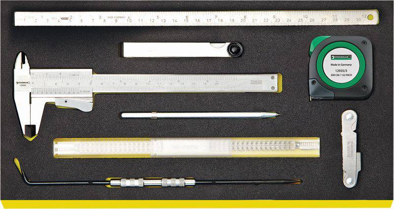 Tool set in foam insert with calliper, ruler, folding rule, measuring tape and various other tools.