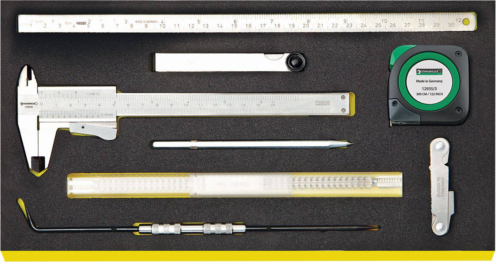 'Foam insert with various measuring tools: calliper, tape measure, protractor, pencil, gauge and ruler.'