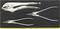 'Three different pliers in a tool holder: top gripping pliers, middle curved long-nose pliers, bottom straight long-nose pliers.'