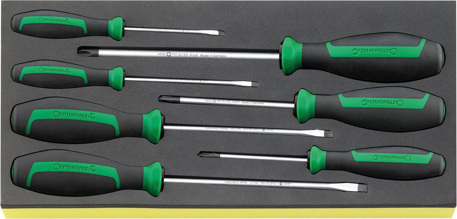 A set of seven screwdrivers in different sizes with black handles and green accents, housed in a foam organiser.
