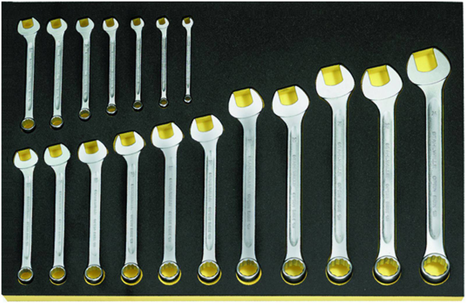 Set of fifteen spanners in various sizes, arranged on a black background, sorted from small to large.