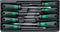 A set of eight screwdrivers in a black plastic container. The handles are green and black.