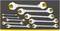 'A collection of nine spanners in various sizes. They are neatly arranged in a black foam insert.'