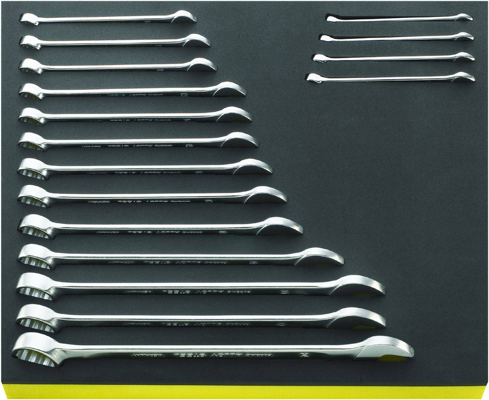 'Set of fourteen double-sided spanners, arranged by size on a black mat.'