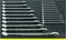 Set of 20 spanners in various sizes, neatly arranged on a black surface, sizes ascending from left to right.