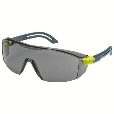 Grey safety glasses with yellow details and tinted lenses, with side protection, on a light background.